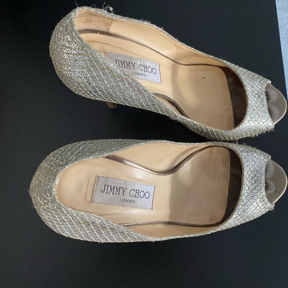 Gently used Jimmy Choo high heeled platform shoes. Perfect for wedding!